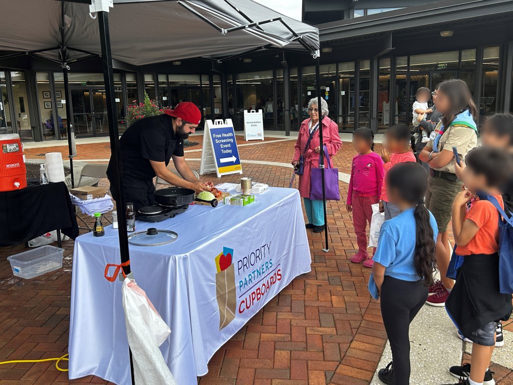 Chef Giacomo Scuito gives a cooking demonstration to children.