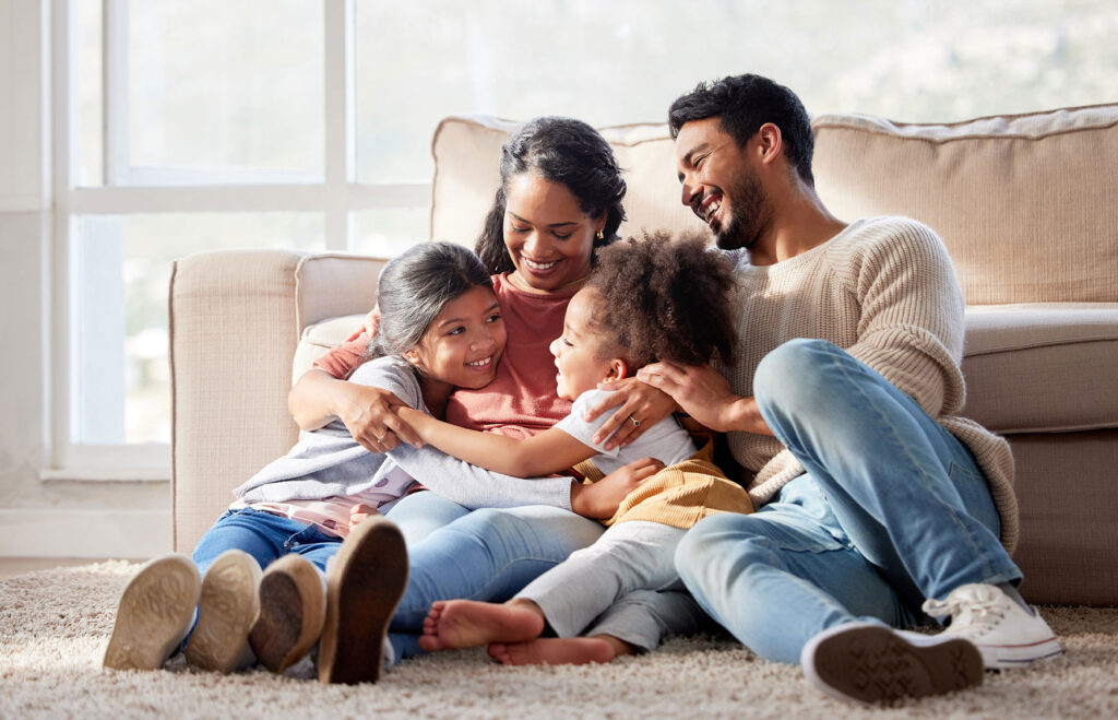 Affectionate and loving mixed race family sitting together.
